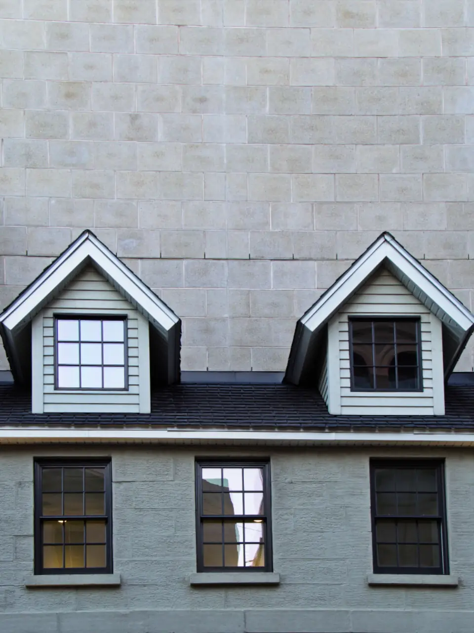 Grey roof with two white dormer windows
