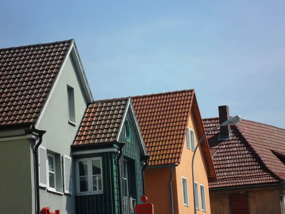 Row of colorful houses with tiled roofs